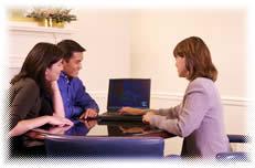 An agent discussing property management with potential tenants.